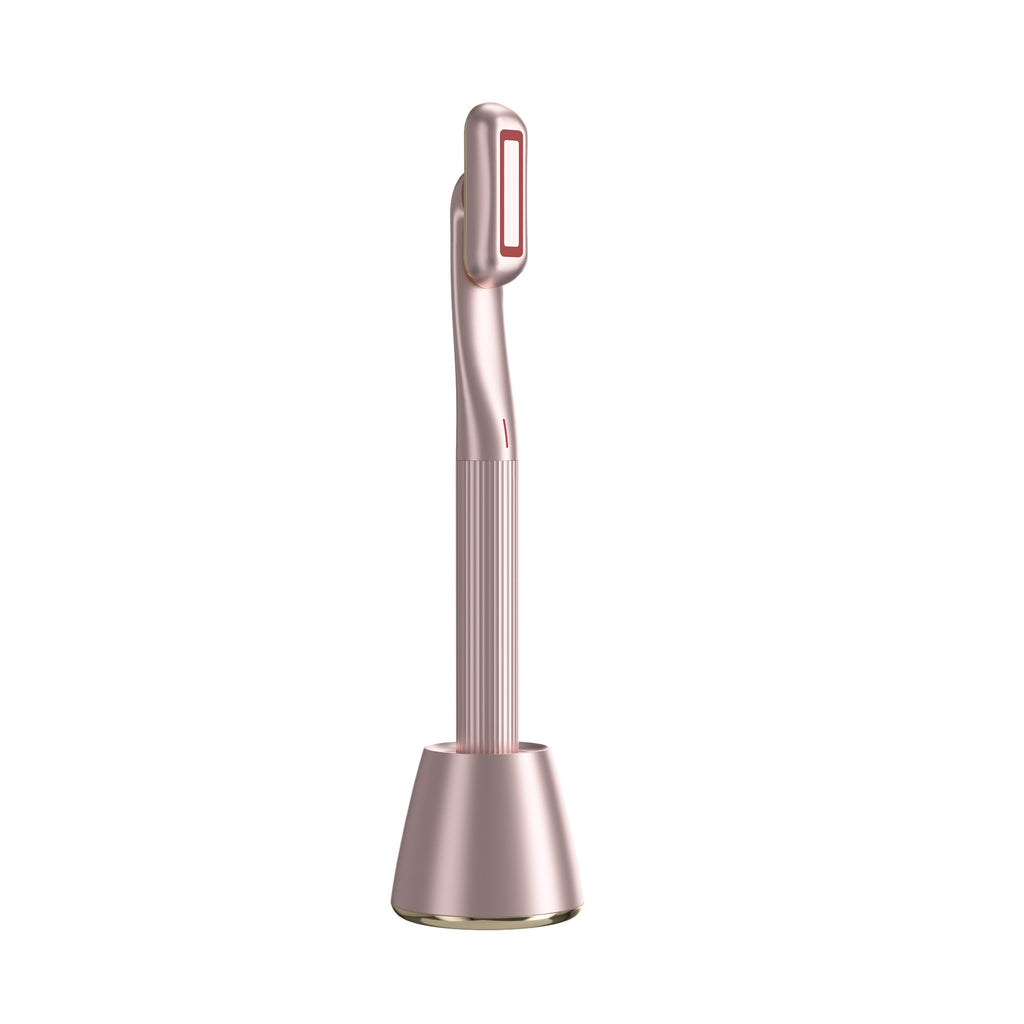 Pink 4-in-1 red light skincare wand standing on charging base for face and neck care