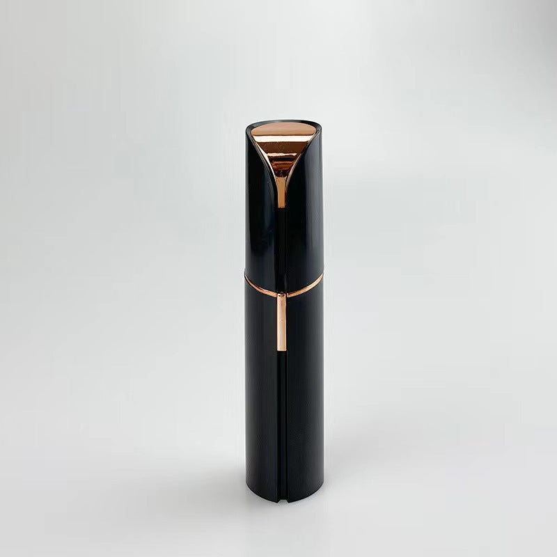 Black and rose gold cylindrical product on a light gray background